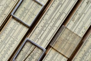 Backgrounds and textures: group of old slide rules, or slipsticks, retro science abstract