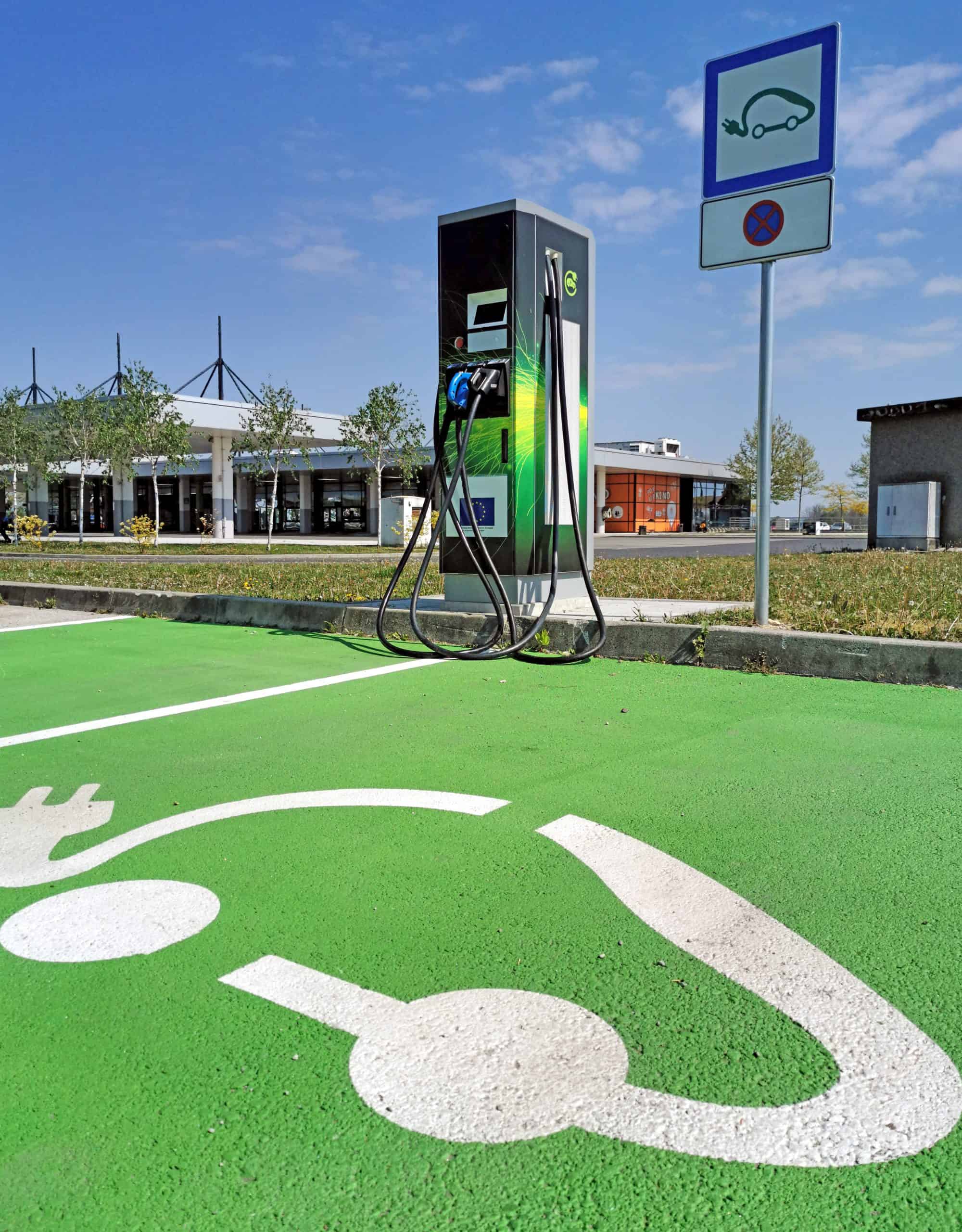 ev-charging-station-on-parking-lot-green-parking-2021-09-02-04-53-57-utc